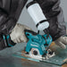 Worker wearing PPE using the Makita CC02R1 Tile/Glass Saw to clean cut a piece of glass