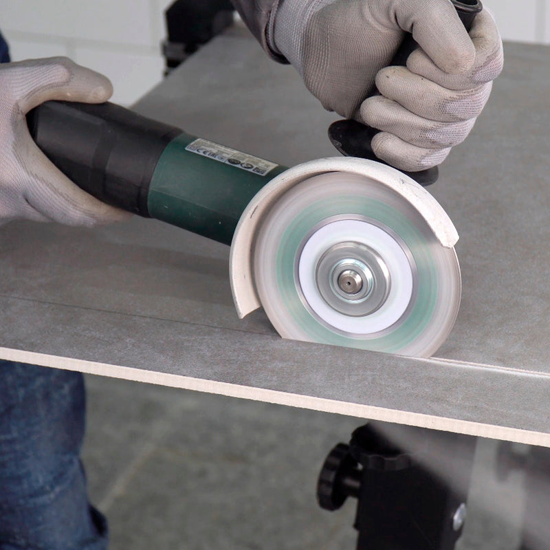 Tile installer using Perfect diamond blade on porcelain tile with clean edge