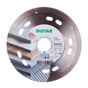 Diamond cutting blade with the brand name DISTAR, designed for cutting ceramic materials. The blade has a silver color, with a combination of solid and transparent areas, and features the text 'ESTHETE' on the label.