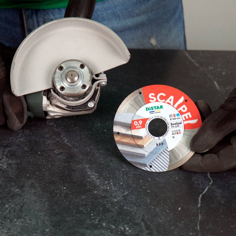 Installer using Scalpel blade for precision cut on porcelain gres tile