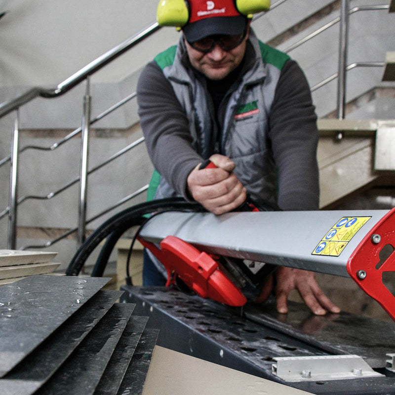 Installer cutting porcelain tile at 45 degree bevel with Edge Diamond Blade
