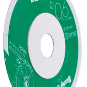 Close-up of a green and white disc with text and graphics.