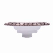 Round white dish with a decorative brown rim on a white background