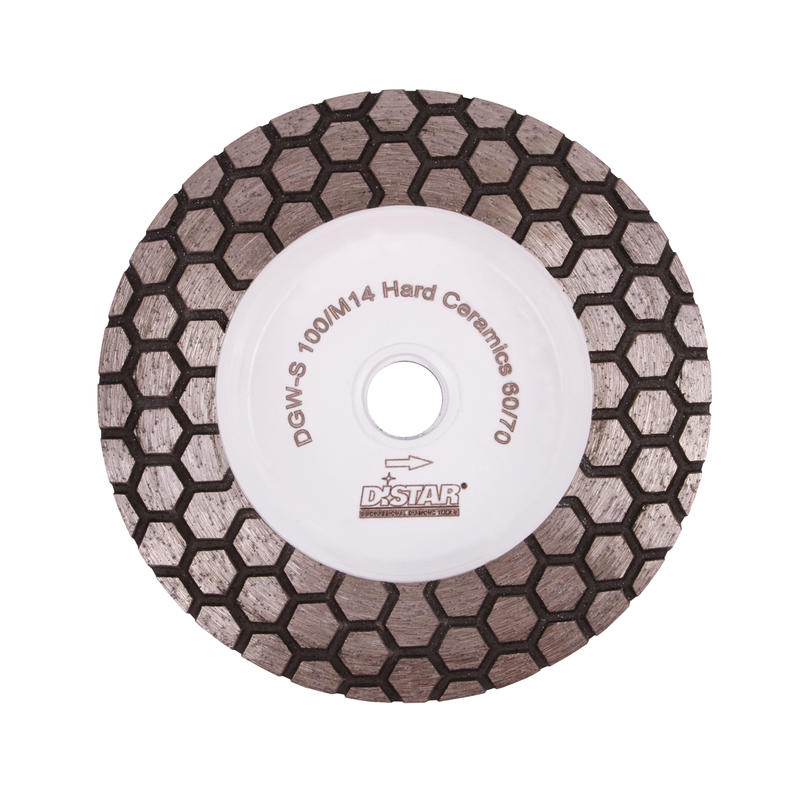 Diamond grinding wheel with a hexagonal pattern, white and gray in color, with the brand name 'Distar' visible.