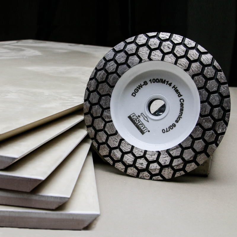 Diamond grinding wheel with honeycomb pattern on a stack of tiles