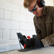 Tile installer using SLIDER 2.0 Cutting Guard on porcelain tile