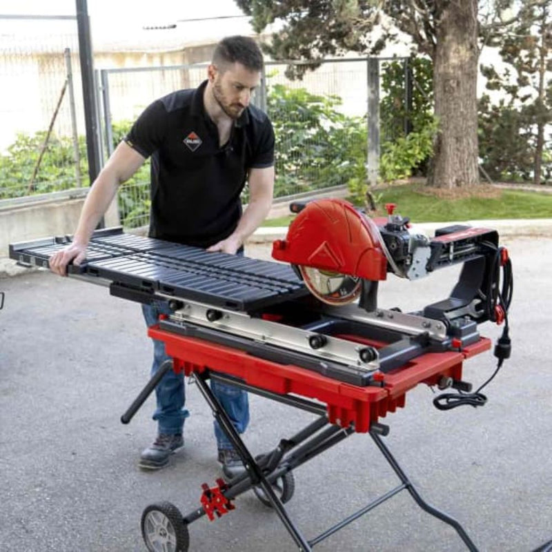 A contractor adding the Rubi extension table to a DT-1o tile saw