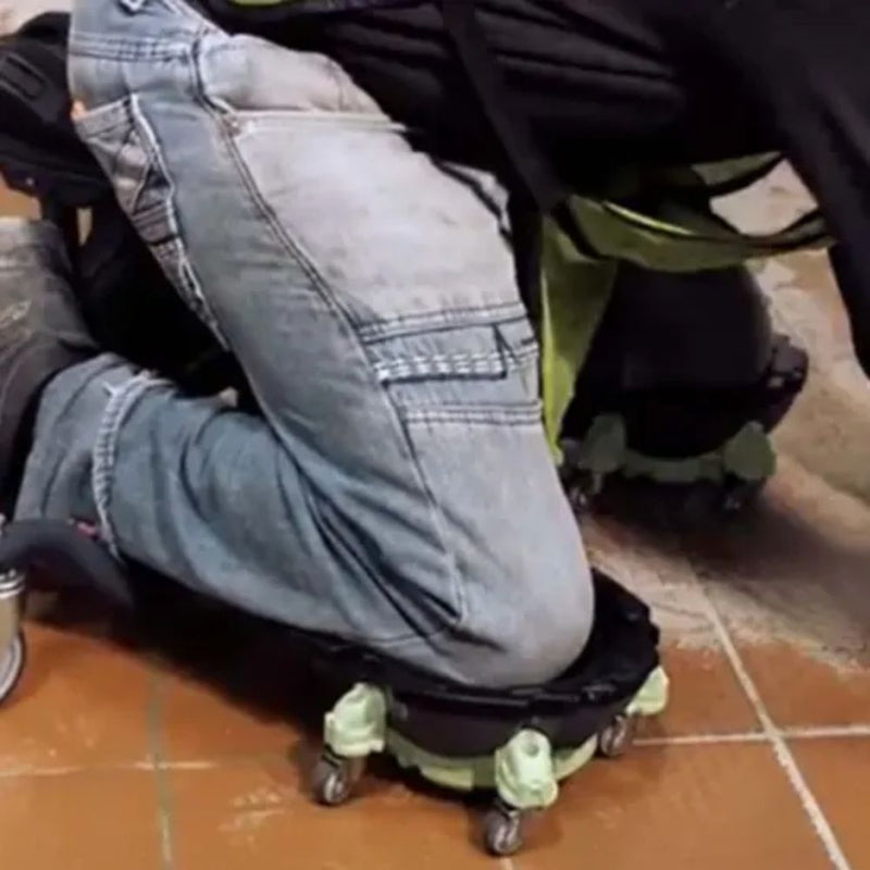 Side view of a man utilizing Kneel-It V3 for efficient and pain-free grout cleaning on a floor