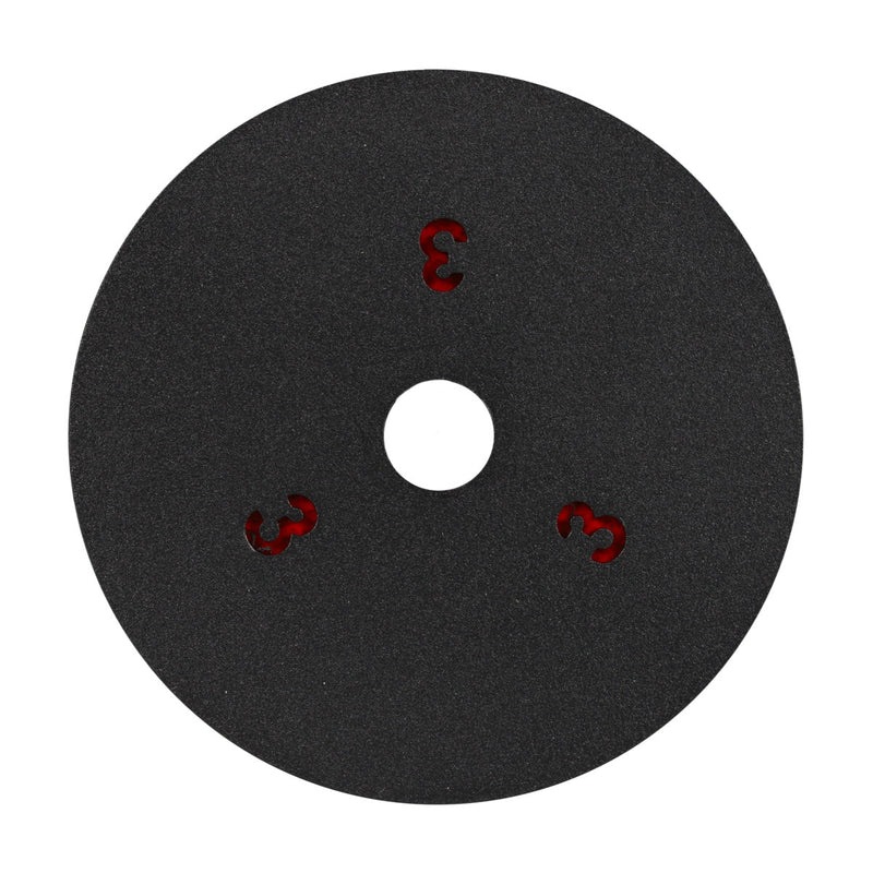 Black circular pad with a central white hole and red number '3' printed on it, on a white background.