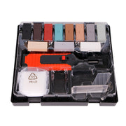 Set of plastic tools and components in a clear plastic case on a white background