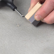 Professional repairing cracked ceramic tile with TileRepairKit
