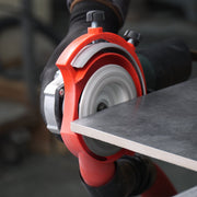 Circular saw cutting a piece of wood with a blurred background