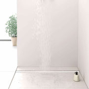 Gruen Artstream Linea modern style linear drain cover installed in a curbless shower