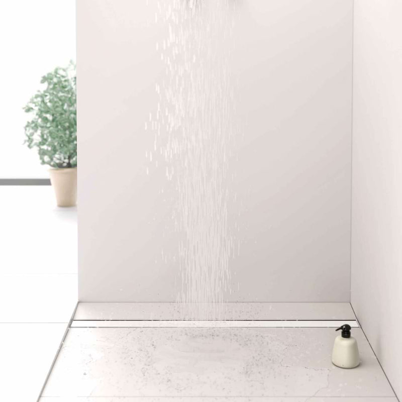 Gruen Artstream Linea modern style linear drain cover installed in a curbless shower