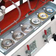 Close-up of a Bulldog machine with multiple diamond grinding wheels on a white background