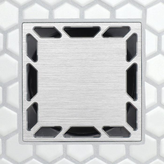 Brushed metal square drain grate with inset rectangular slots around the edges