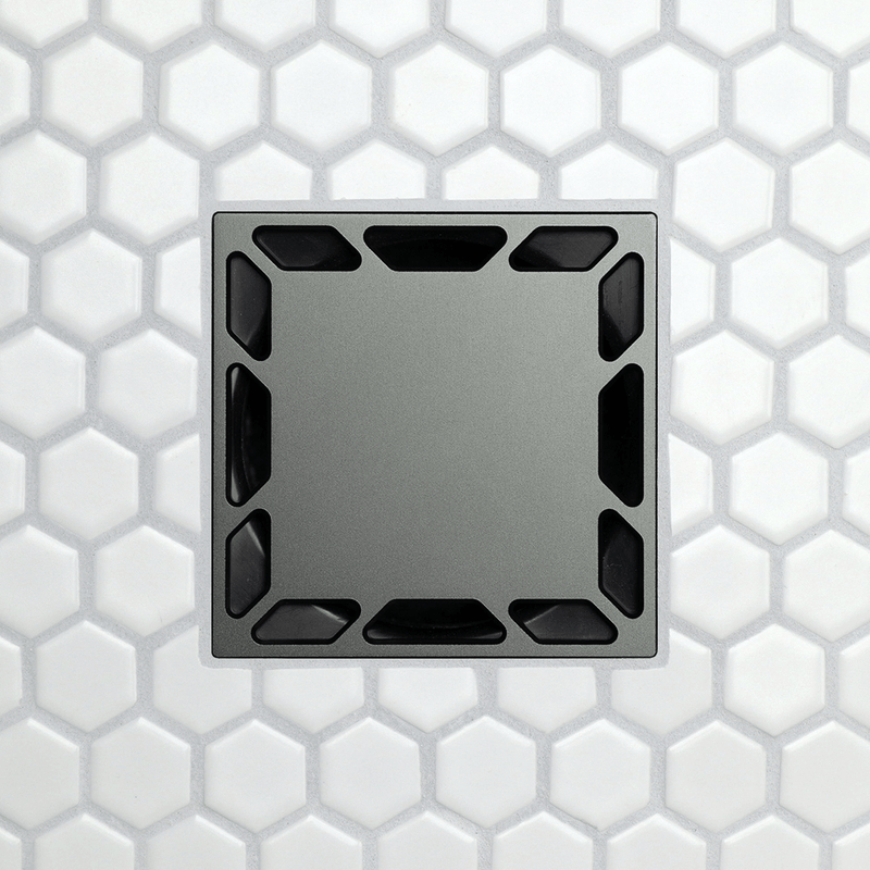 Square drain grate with corner notch openings, dark metal faceplate.