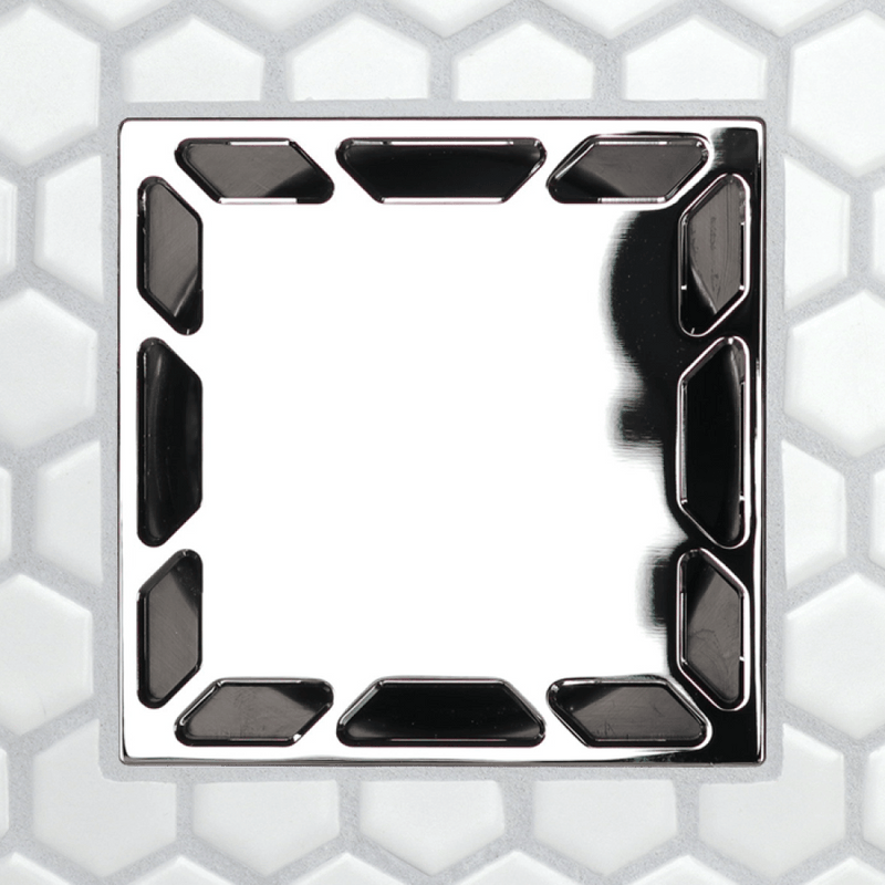 Square drain grate with glossy black openings along edges and darker central slot shapes