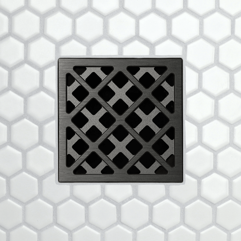 Drain grate with X-pattern metal frame and square opening tiles, brushed dark finish