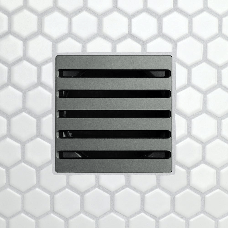 Drain grate with five long horizontal slots, dark matte finish.