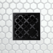 FloFX drain grate with chainlink pattern metal frame and square opening tiles, matte black finish