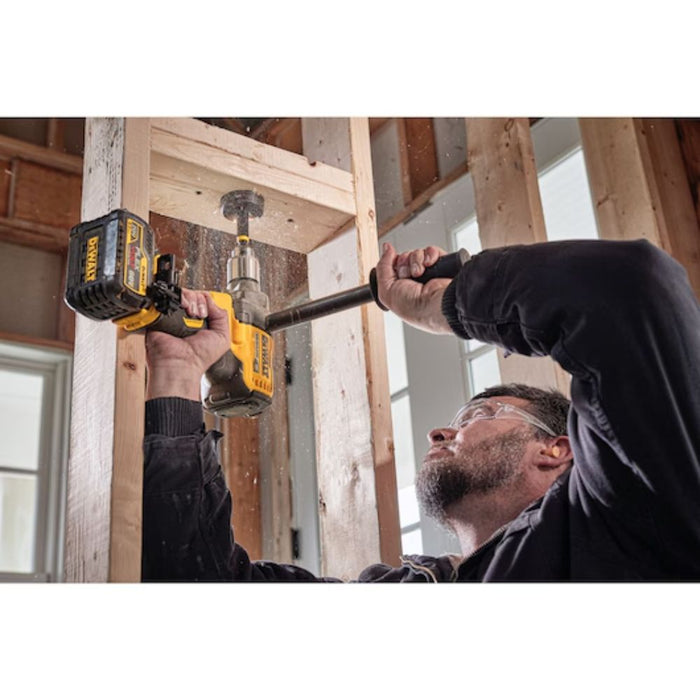 Contractor using DEWALT 60V MAX Mixer/Drill with E-CLUTCH® to drill overhead in wall frame