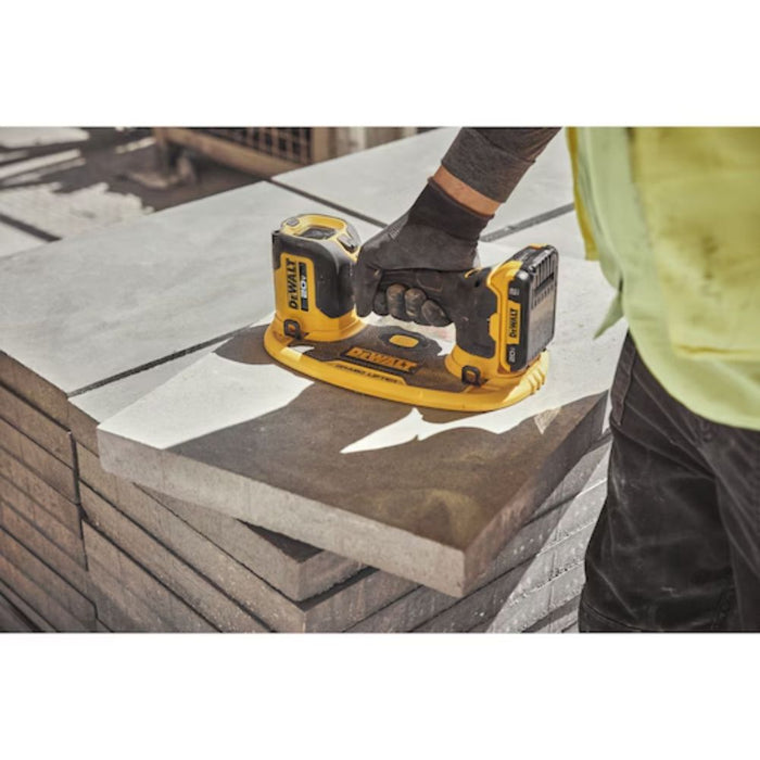 Close-up of Dewalt 20V MAX GRABO Lifter suction cup grip on textured concrete surface