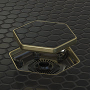 Tile-in hex drain opening with champagne gold frame and dark hex insert