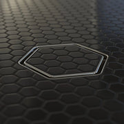 Tile-in hex drain insert with polished chrome rim and hex-pattern grate