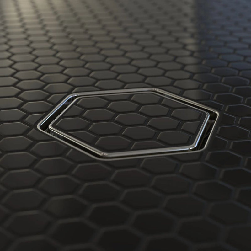 Tile-in hex drain insert with polished chrome rim and hex-pattern grate