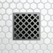 Drain grate with forty-five pattern diamond cutouts on brushed chrome finish.