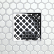 Drain grate with diamond-grid pattern, metal frame with rectangular channel slots, polished chrome finish