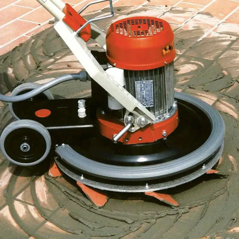 Maxititina being used to grout tile floor