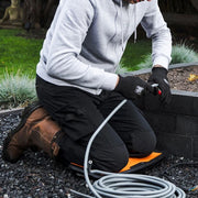 Homeowner kneeling on FENTO BOARD M2 on concrete slab