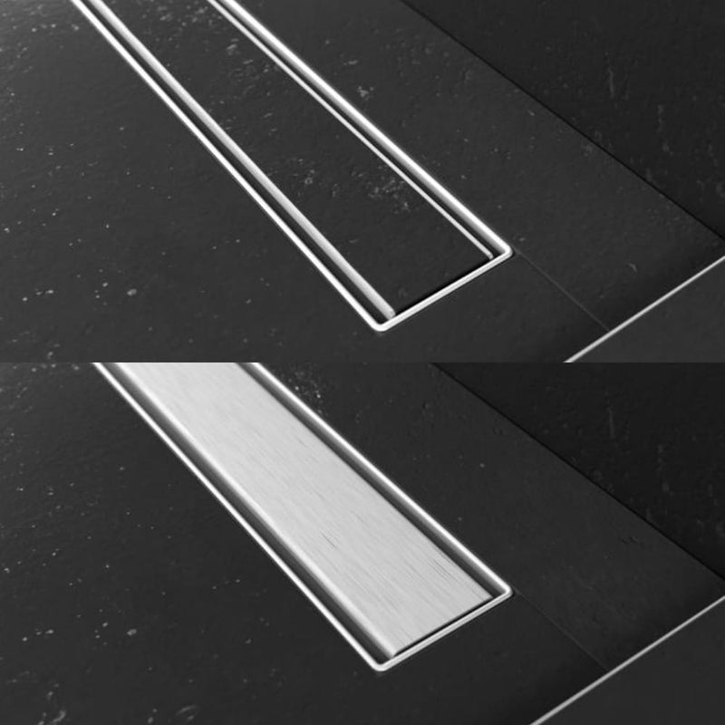 Close-up of the Proline's removable Nova drain cover, demonstrating its versatility as a metallic cover or tile-in option