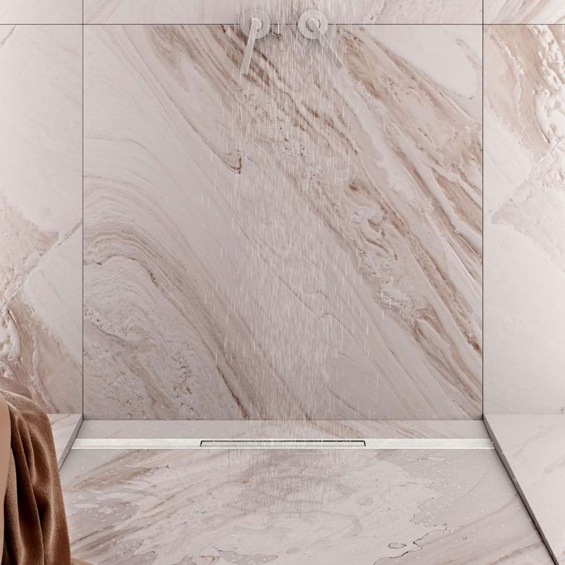 Gruen Pera Linear Drain positioned near the wall of a stylish, modern shower, highlighting its versatile usage options