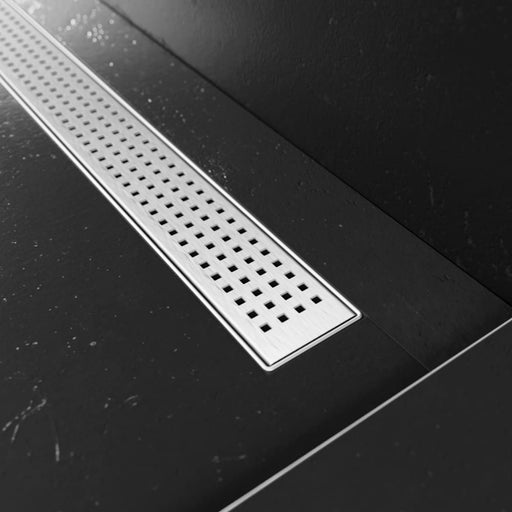 Close-up of the Proline's removable Quadra drain cover, with it's modern metallic cover