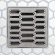 FloFX drain grate with long center slots and rounded edge openings, brushed metal finish