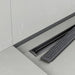 Close-up of the Proline's removable Quadra drain cover, with it's modern anthracite cover