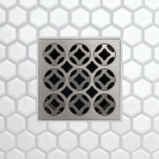 Square drain grate with 3x3 circular openings, brushed metal finish