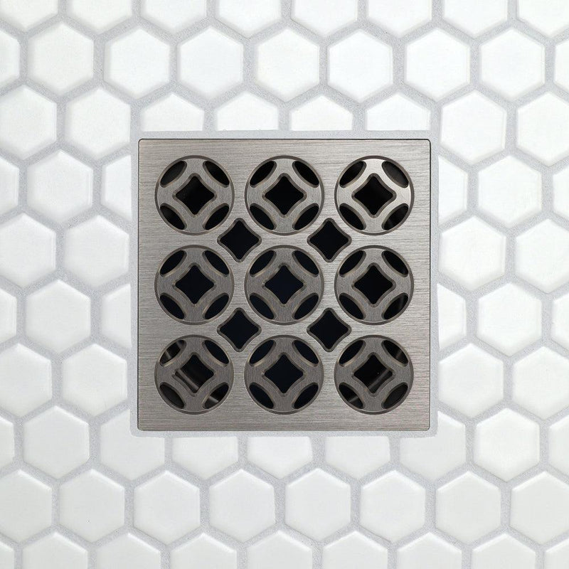 Square drain grate with 3x3 circular openings, brushed metal finish