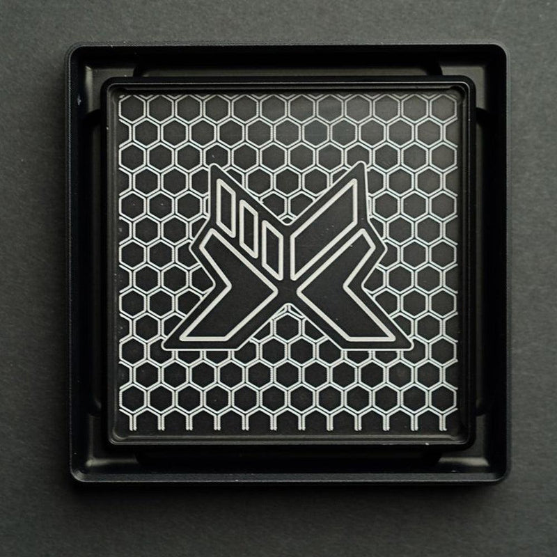 3D hex grille insert with X motif, black frame and chrome accents