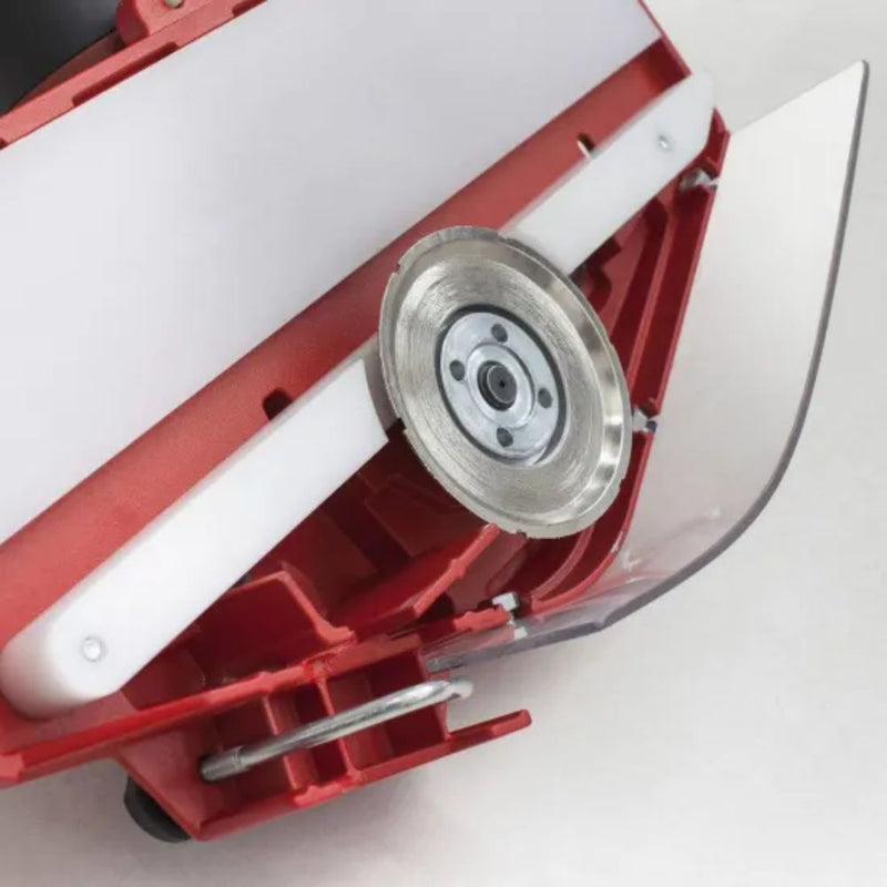 The underside of the Montolit Toprofile displaying the scratch resistent guide, guard, and profile wheel