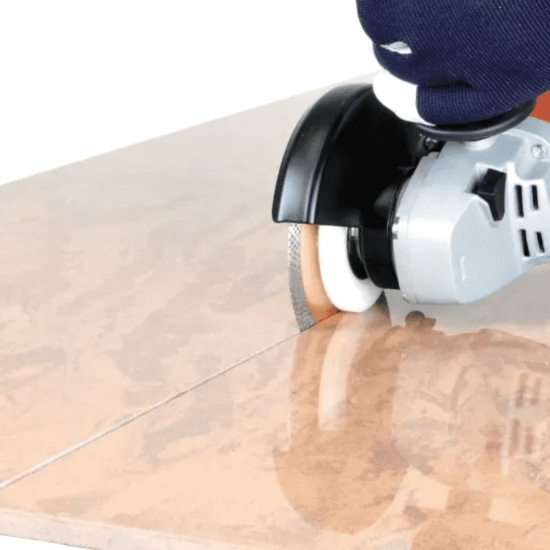 The Montolit TutorCut Grinder Blade Guide being used to guide a make straight cuts on tile.