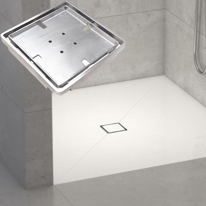Tileable Square shower drain in a tiled bathroom setting