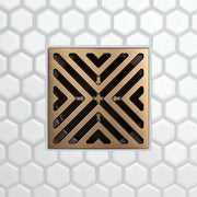 FloFX drain grate with X-Factor V-slot pattern, brushed bronze frame and black openings
