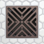 Bronze square FloFX drain grate with X-slot design and dark recessed openings