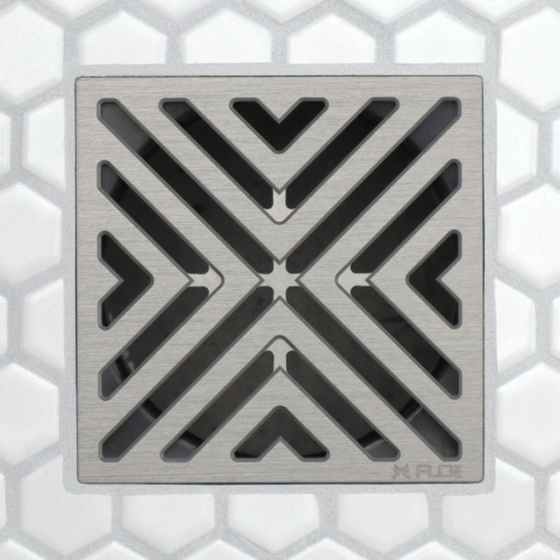 FloFX drain grate with chevron/V-shaped openings in brushed silver-tone finish