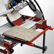 Thick outdoor paver being cut on Raimondi Zipper saw with Raimondi Extension Side Square accessory