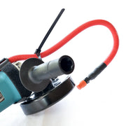 Side view of Hydrotail mounted on angle grinder showing universal tool compatibility